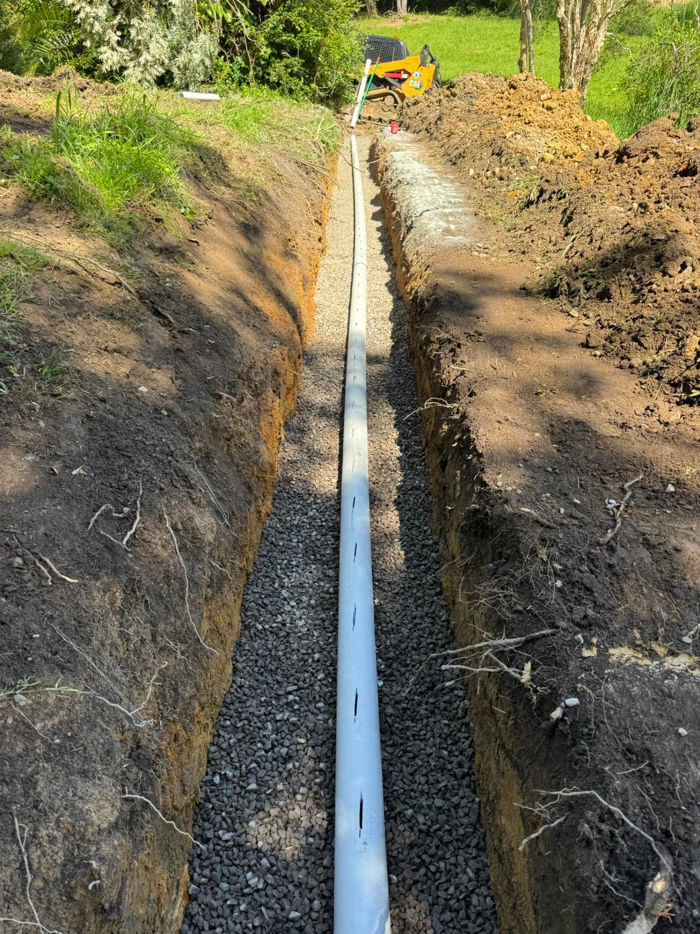 Agricultural drainage trench with gravel & pipe