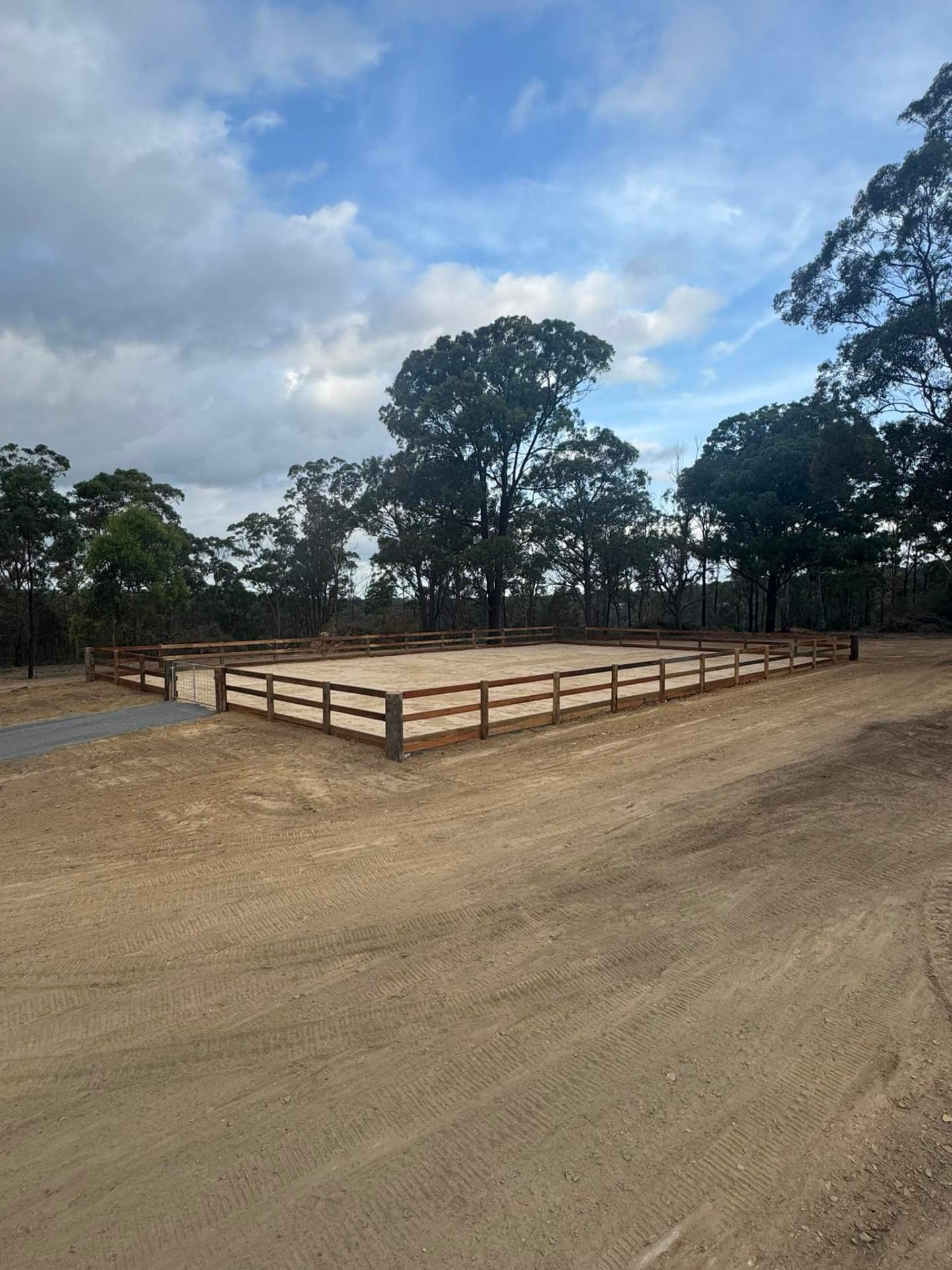 Custom-built horse arena with timber fencing