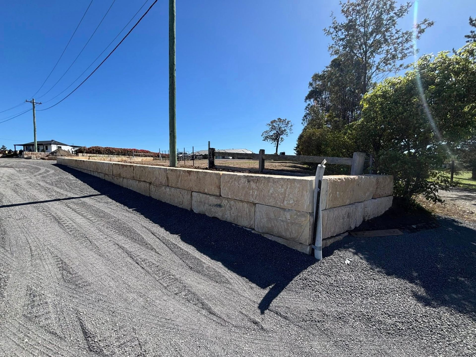 Long sandstone block retaining wall