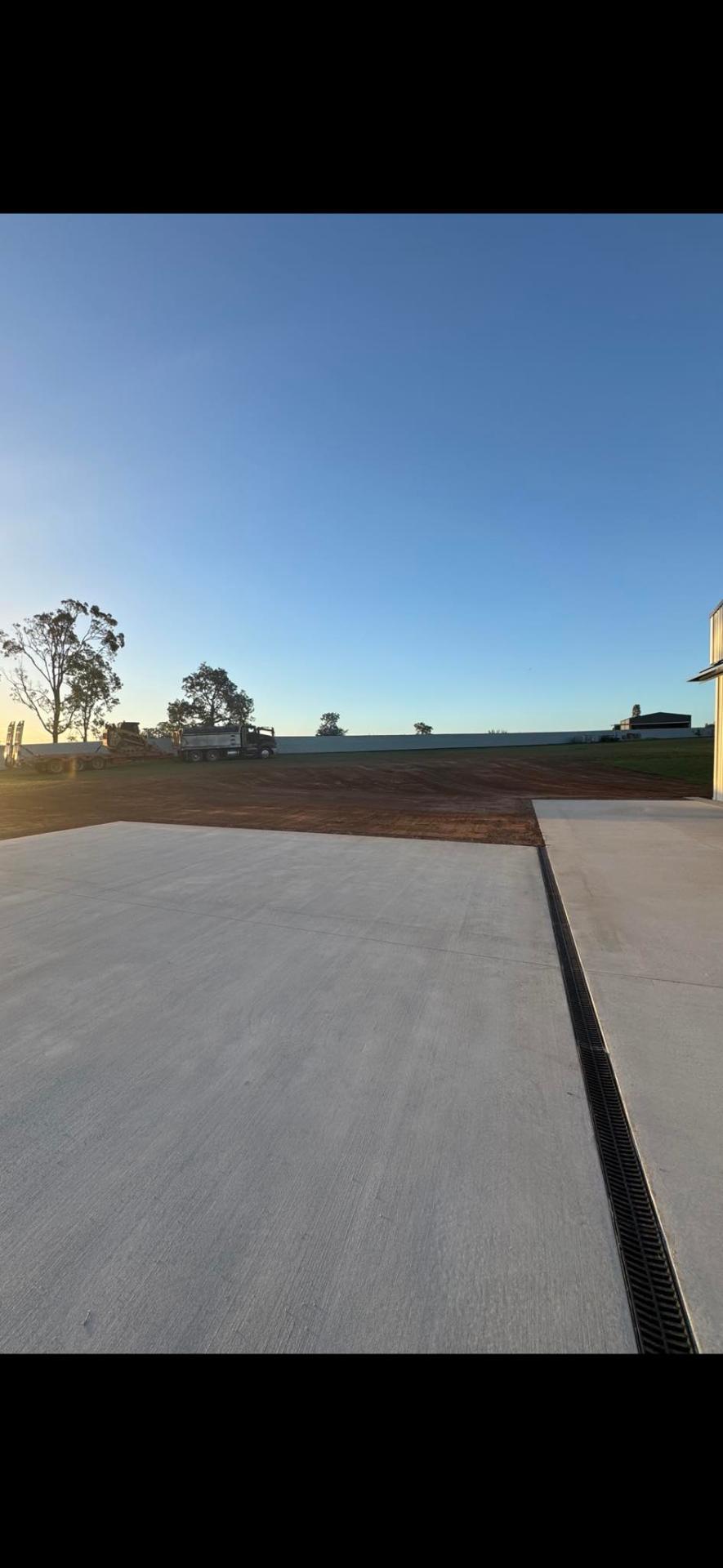 Large concrete shed slab with drainage grate