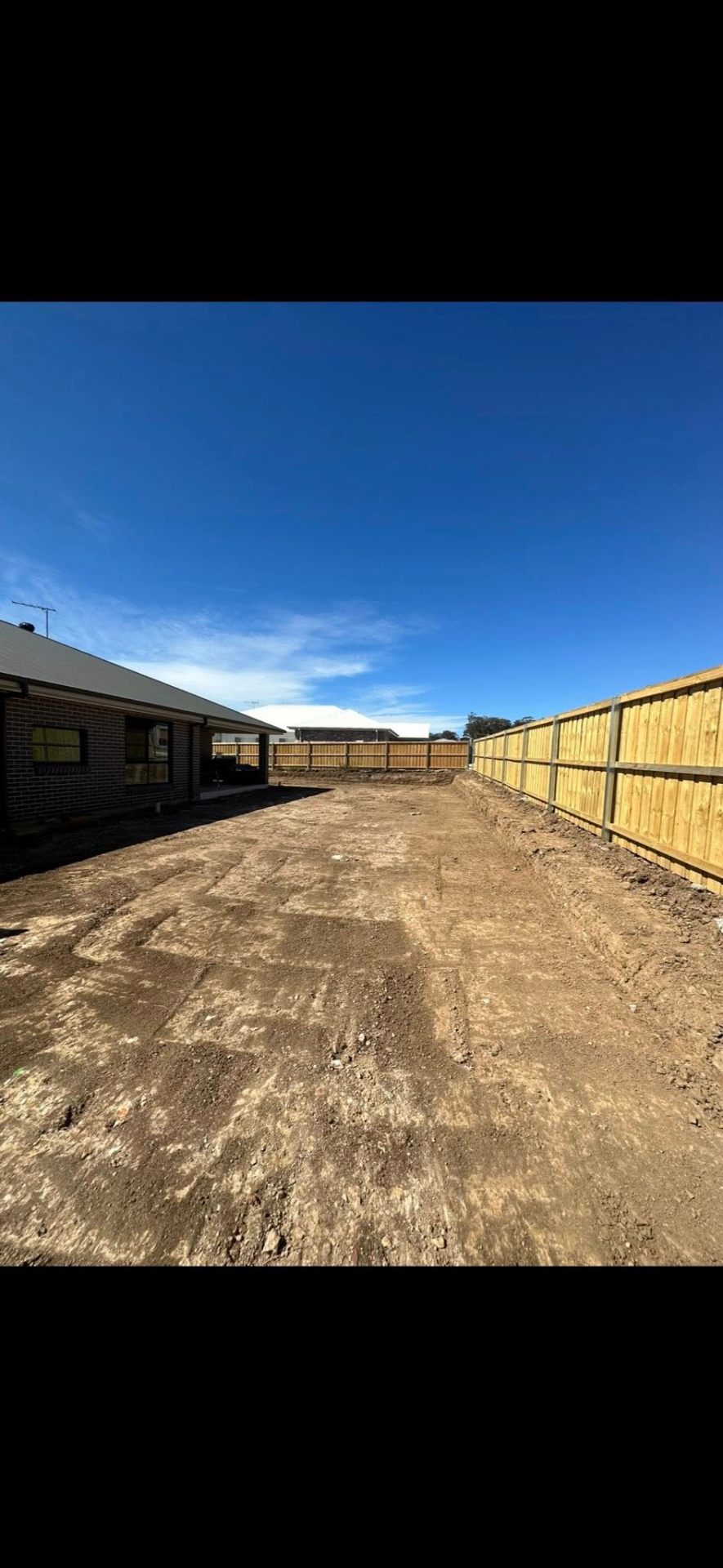 Side yard excavation & timber paling fence