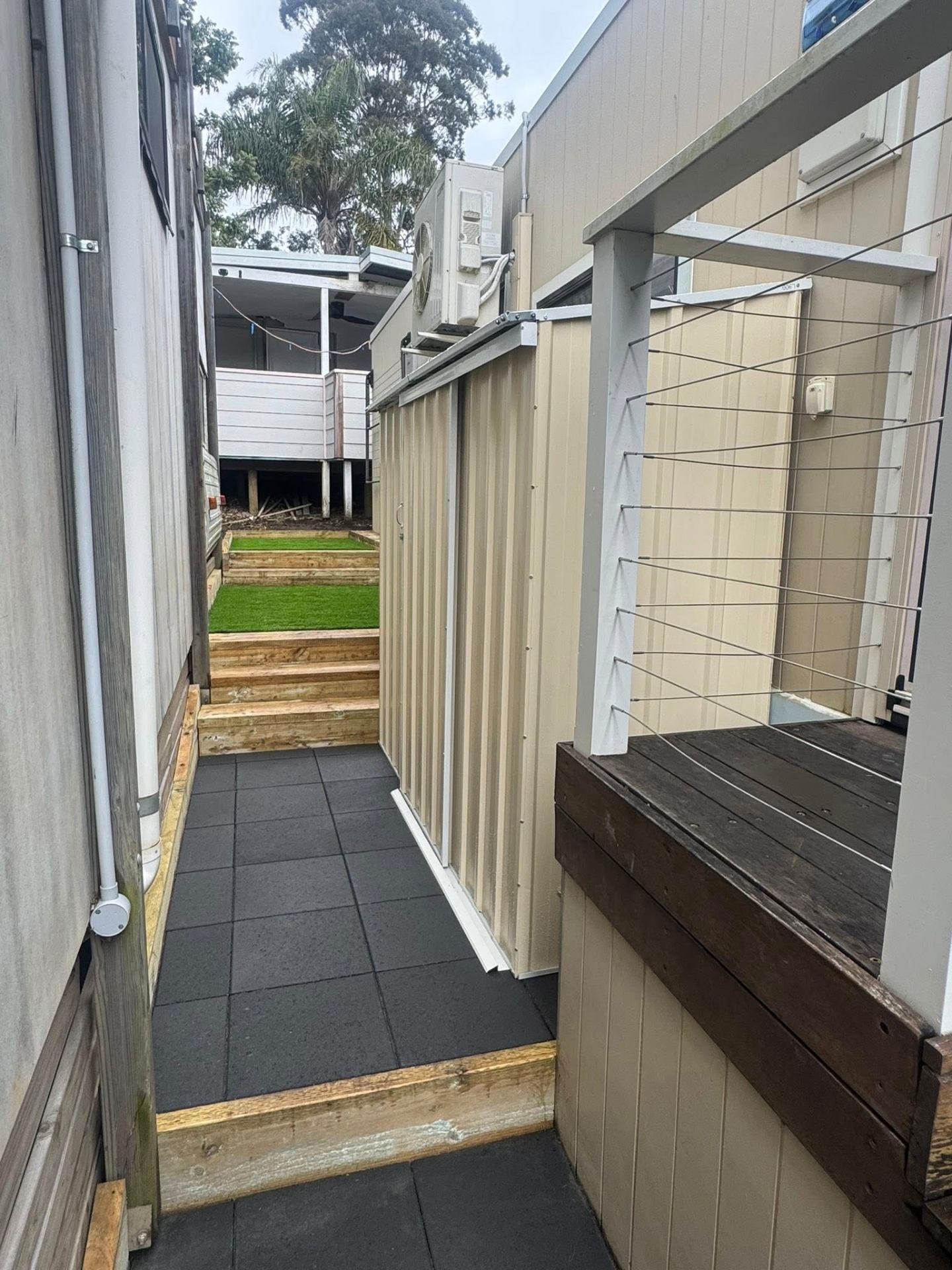 Tiled side pathway & timber steps
