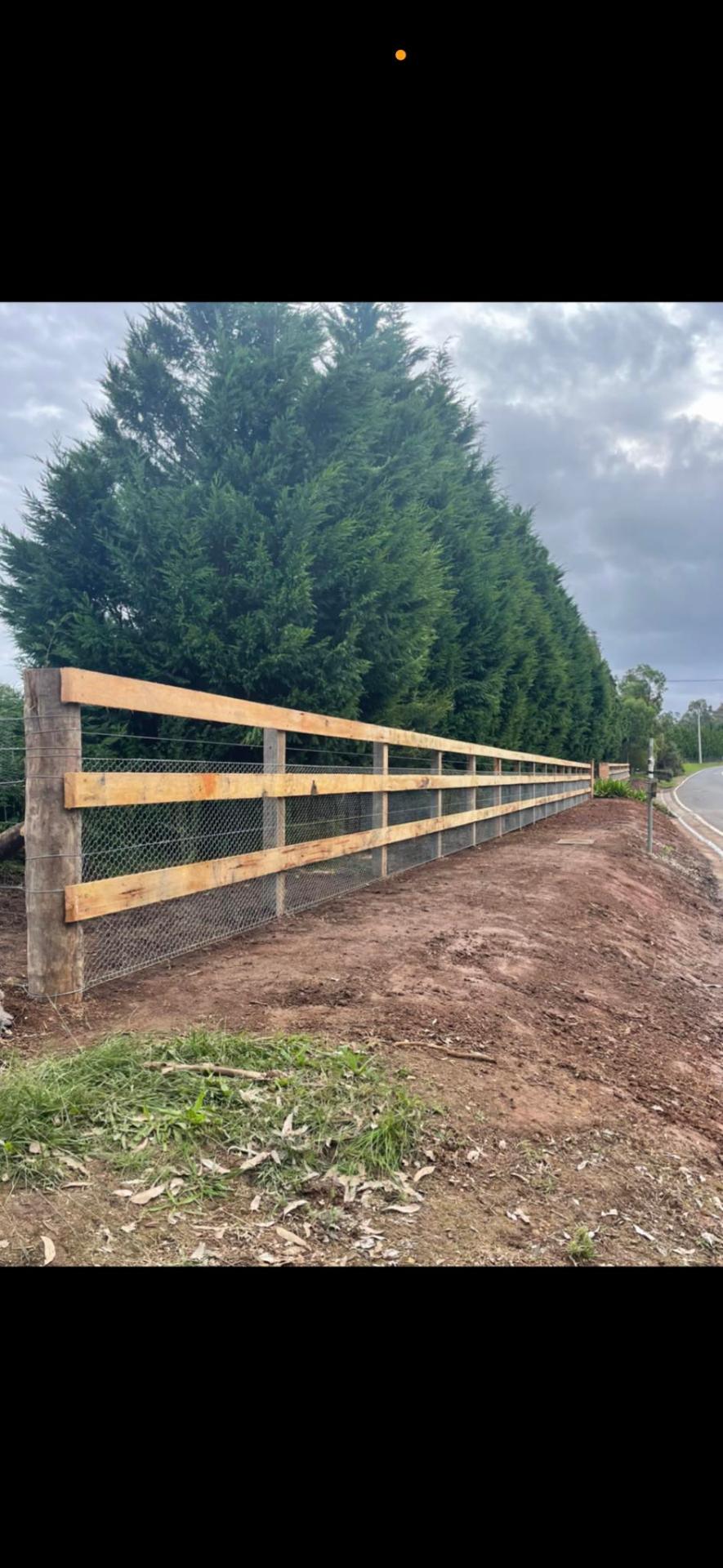 Timber post & rail fence with mesh infill